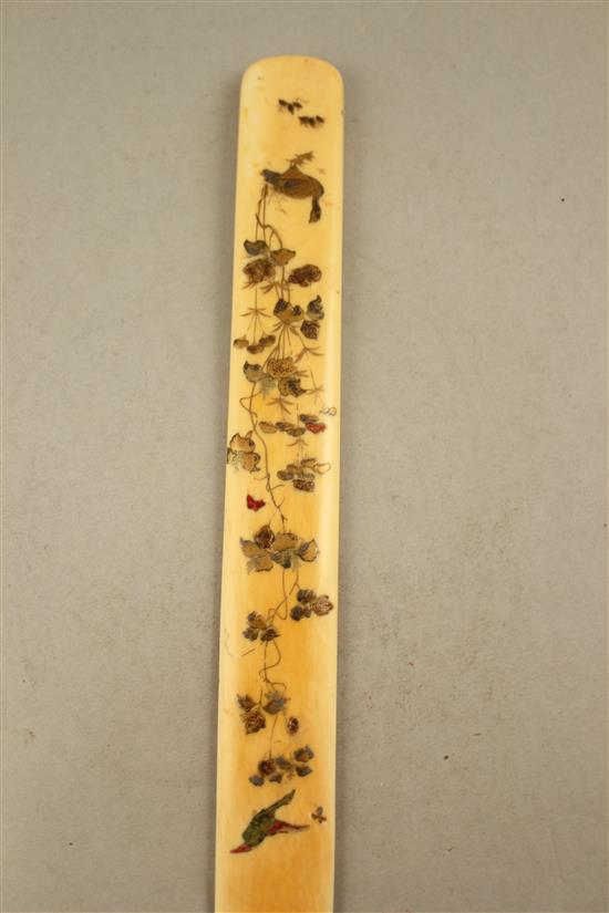 A Japanese ivory and shibayama type page turner, Meiji period, 38cm., restorations